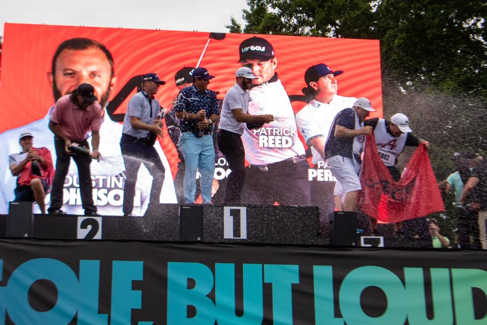 The Aces team (Pat Perez, Talor Gooch, Patrick Reed and Dustin Johnson) celebrate after finishing in first place at the LIV Golf tournament at Trump National Golf Club in Bedminster, N.J., on July 31.