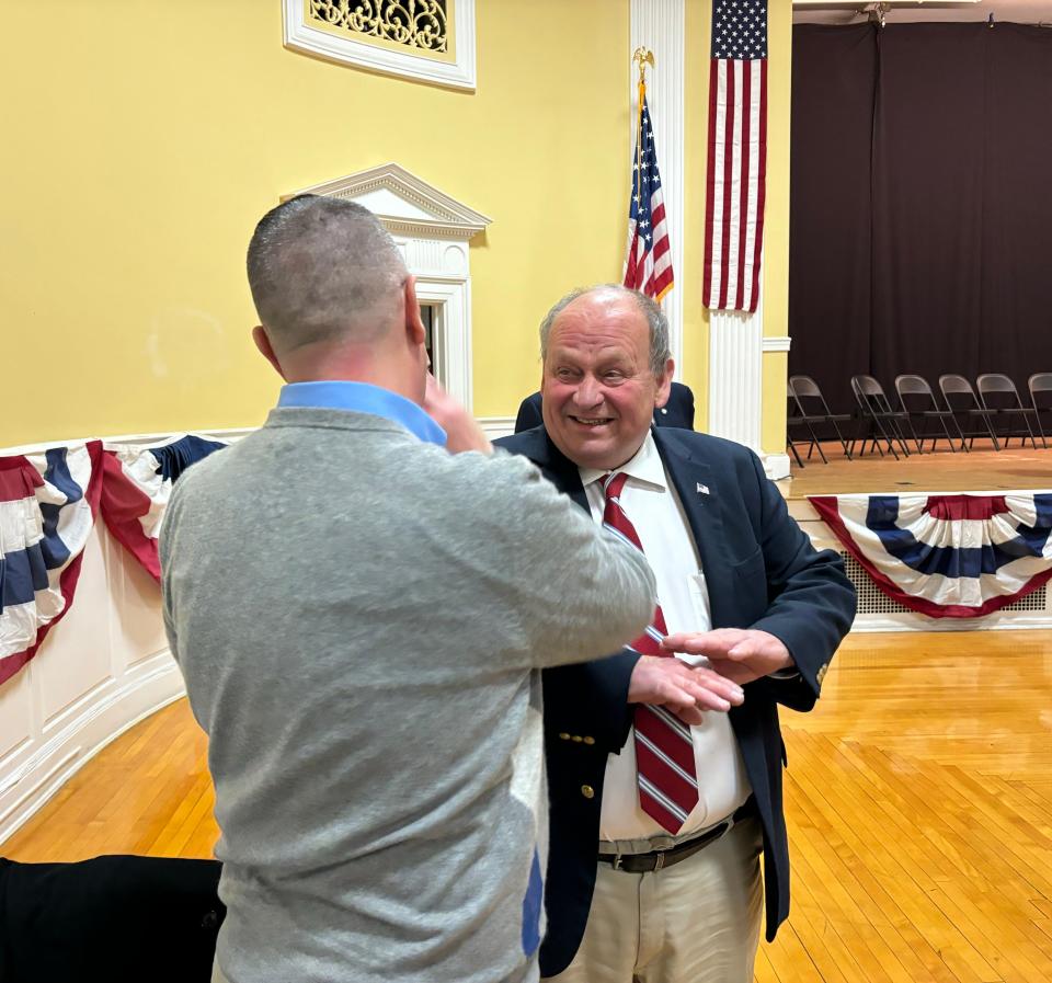 Dover Mayor Bob Carrier was sworn in for his third and final term as the city's mayor at the city's inauguration for elected officials on Tuesday, Jan. 2, 2024. Here, Carrier is seen chatting with outgoing Somersworth Mayor Dana Hilliard.