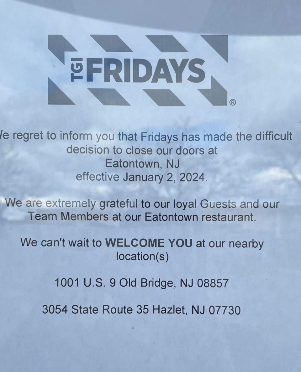 A sign on the entrance to TGI Fridays in Eatontown tells patrons the restaurant's location has been closed.