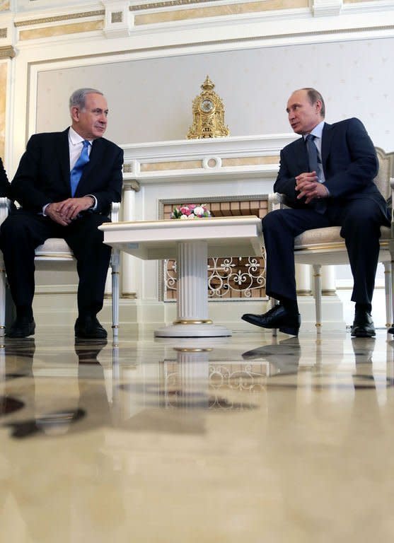 Russia's President Vladimir Putin (R) and Israeli Prime Minister Benjamin Netanyahu meet in Sochi, on May 14, 2013. The two leaders discussed the conflict in Syria as concern grew about Moscow's arms deliveries to the Damascus regime and a spiralling death toll