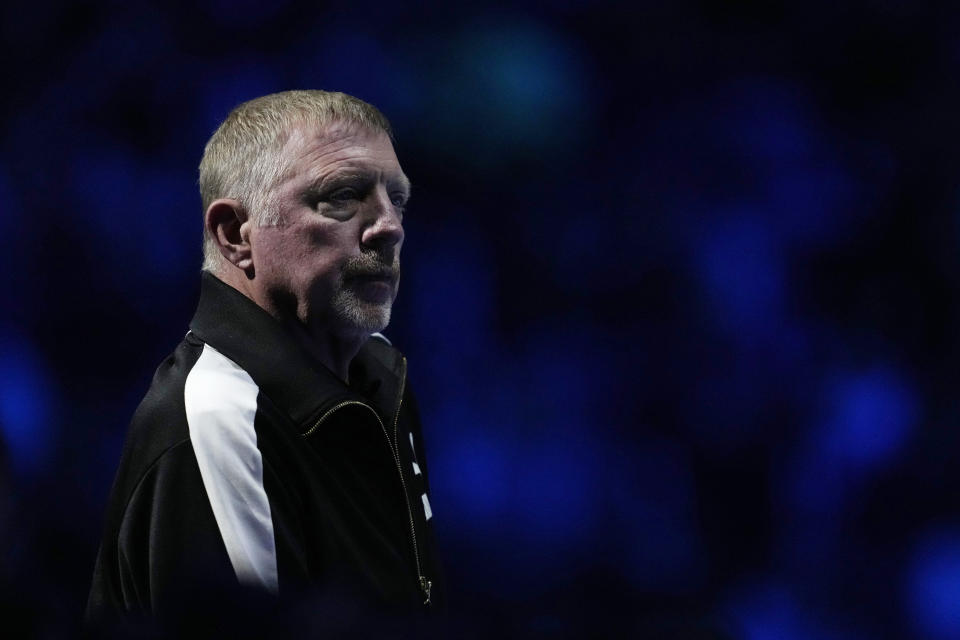 Germany's Boris Becker, coach of Denmark's Holger Rune, stands during the singles tennis match between Serbia's Novak Djokovic and Denmark's Holger Rune, of the ATP World Tour Finals at the Pala Alpitour, in Turin, Italy, Sunday, Nov. 12, 2023. (AP Photo/Antonio Calanni)