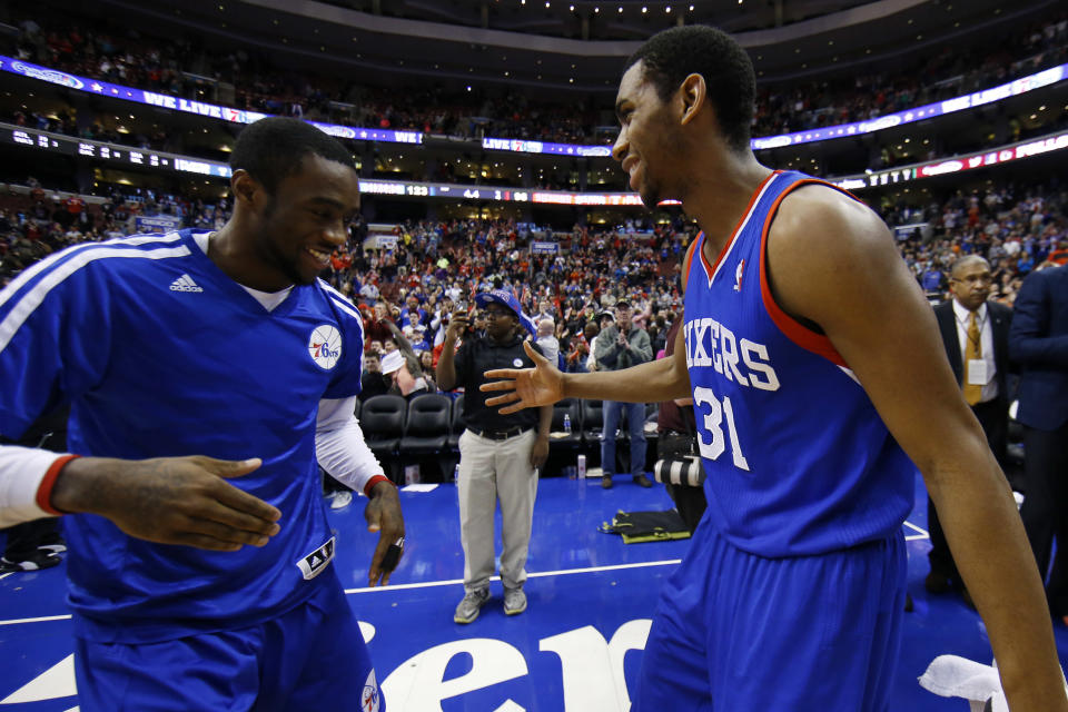 Philadelphia 76ers' Tony Wroten, left, and Hollis Thompson celebrate after an NBA basketball game against the Detroit Pistons, Saturday, March 29, 2014, in Philadelphia. Philadelphia won 123-98, breaking a 26-game losing streak. (AP Photo/Matt Slocum)