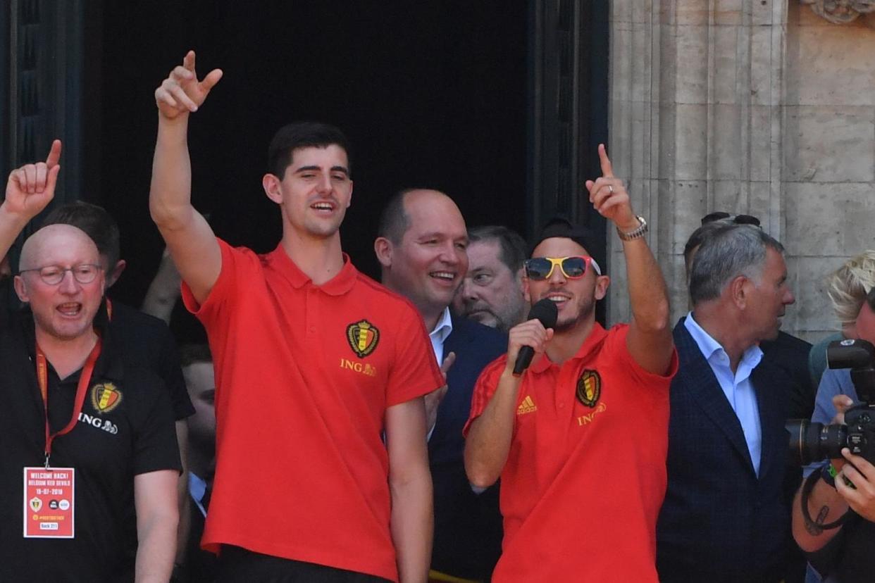 Uncertain futures: Courtois and Hazard take the applause ahead of three weeks off: AFP/Getty Images