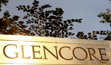 FILE PHOTO: The logo of commodities trader Glencore is pictured in front of the company's headquarters in Baar, Switzerland, July 18, 2017. REUTERS/Arnd Wiegmann/File Photo