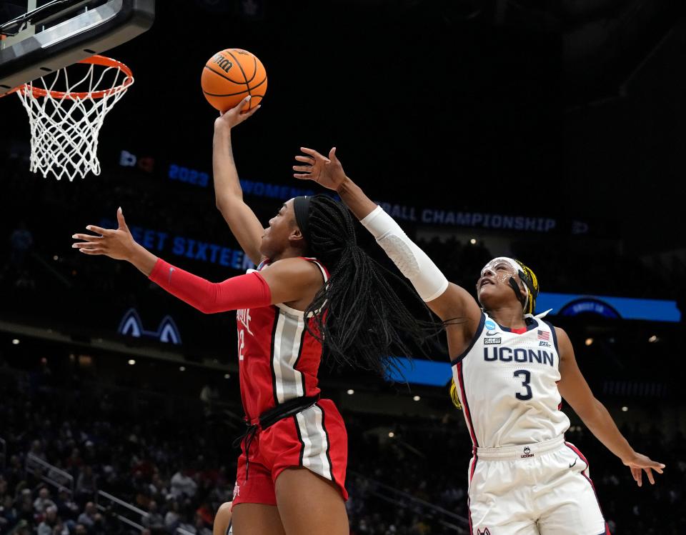 March 25, 2023; Seattle, WA, USA; Ohio State Buckeyes forward Cotie McMahon (32) is guarded by UConn Huskies forward Aaliyah Edwards (3) during the first half of an NCAA Tournament Sweet Sixteen game at Climate Pledge Arena in Seattle on Saturday. Mandatory Credit: Barbara J. Perenic/Columbus Dispatch