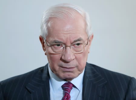 Former Ukrainian Prime Minister Mykola Azarov attends an interview with Reuters in Moscow