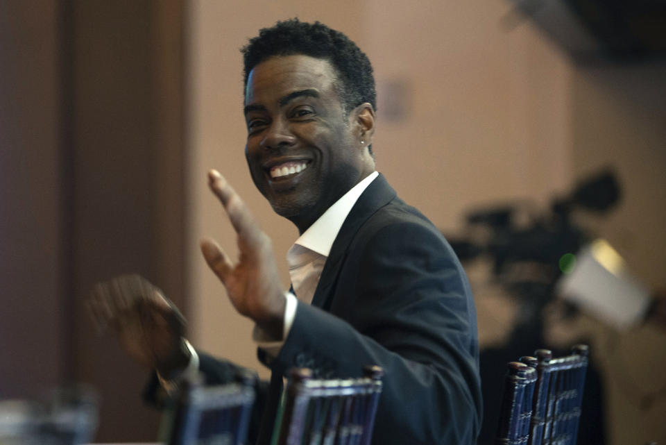 Chris Rock smiles before the start of the 24th Annual Mark Twain Prize for American Humor at the Kennedy Center for the Performing Arts on Sunday, March 19, 2023, in Washington. (AP Photo/Kevin Wolf)