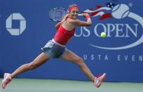 Victoria Azarenka of Belarus hits a return to Alize Cornet of France at the U.S. Open tennis championships in New York August 31, 2013. REUTERS/Kena Betancur