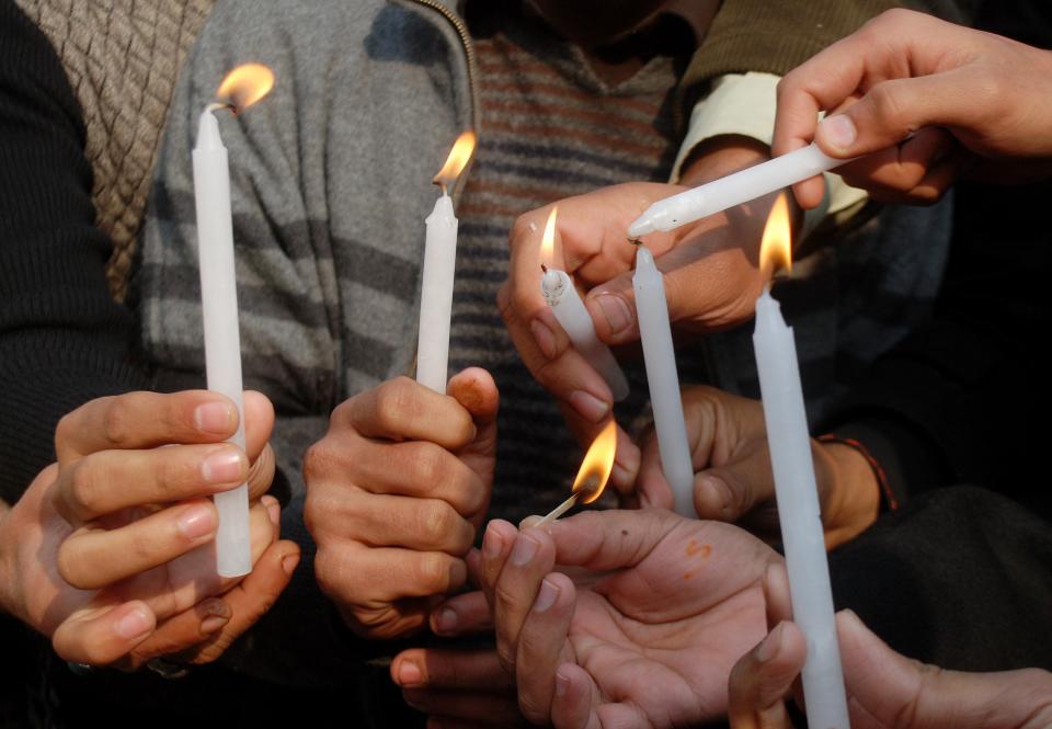 People light candles in memory of victims of the Taliban attack on the Army Public School, during a rally in Peshawar, December 17, 2014. At least 132 students and nine staff members were killed on Tuesday when Taliban gunmen broke into the school and opened fire, witnesses said, in the bloodiest massacre the country has seen for years. REUTERS/Khuram Parvez (PAKISTAN - Tags: CRIME LAW SOCIETY CIVIL UNREST)