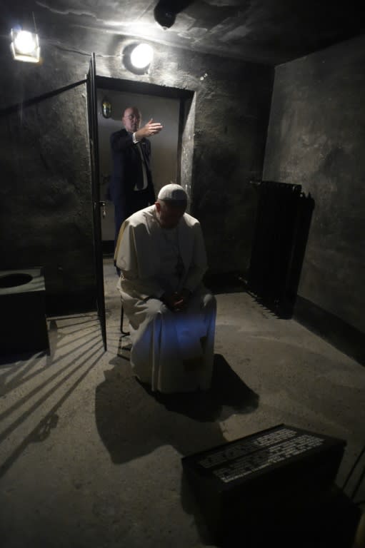 Pope Francis prays in the cell of Polish priest Maximilian Kolbe at the Auschwitz Nazi death camp on July 29, 2016