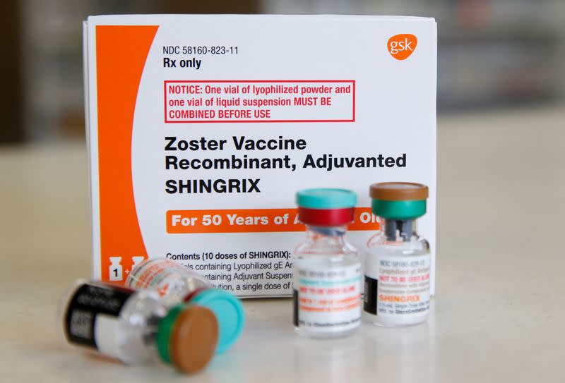 FILE PHOTO: A box and vials of the drug Shingrix, made by GlaxoSmithKline Pharmaceutical, sit on a counter at a pharmacy in Provo