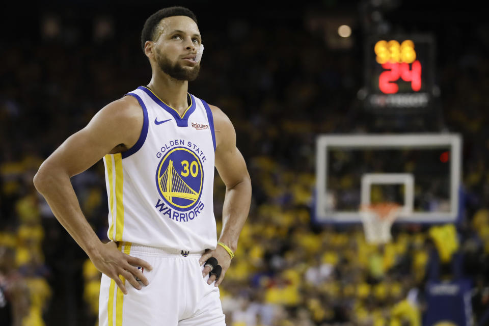 Golden State Warriors guard Stephen Curry (30) walks on the floor during the first half of Game 3 of basketball's NBA Finals against the Toronto Raptors in Oakland, Calif., Wednesday, June 5, 2019. (AP Photo/Ben Margot)