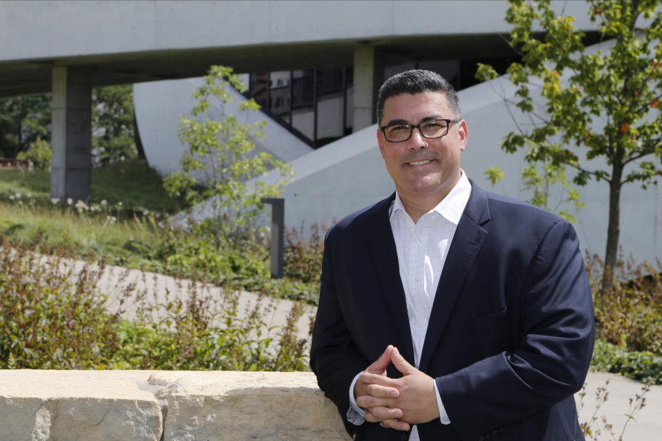 In this photo made on July 31, 2020, Jason Dominguez poses for a photo at the National Veterans Memorial and Museum, in Columbus, Ohio. Dominguez was a Marine that was in the Columbus, Ohio-based Lima Company that served in Iraq, when the vehicle immediately behind his in a convoy was blown up by a roadside bomb Aug. 3, 2005, killing 15. Some survivors and families of those killed had planned a 15-year reunion this weekend, but it had to be canceled amid restrictions for the COVID-19 pandemic. (AP Photo/Jay LaPrete)