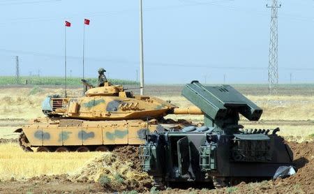 A Turkish soldier on a tank is seen during a military exercise near the Turkish-Iraqi border in Silopi, Turkey, September 19, 2017. Dogan News Agency, DHA via REUTERS