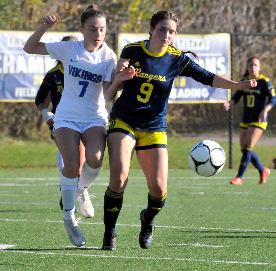 Spencerport's Bre DeHond (9) and Renee DeLaura battle for possession during Saturday's Class A state quarterfinal.