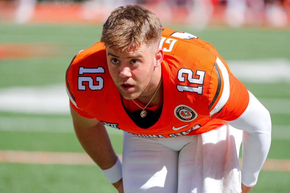 Oct 14, 2023; Stillwater, Oklahoma, USA; Gunnar Gundy (12) warms up before an NCAA football game between Oklahoma State (OSU) and Kansas at Boone Pickens Stadium. Mandatory Credit: Nathan J. Fish-USA TODAY Sports