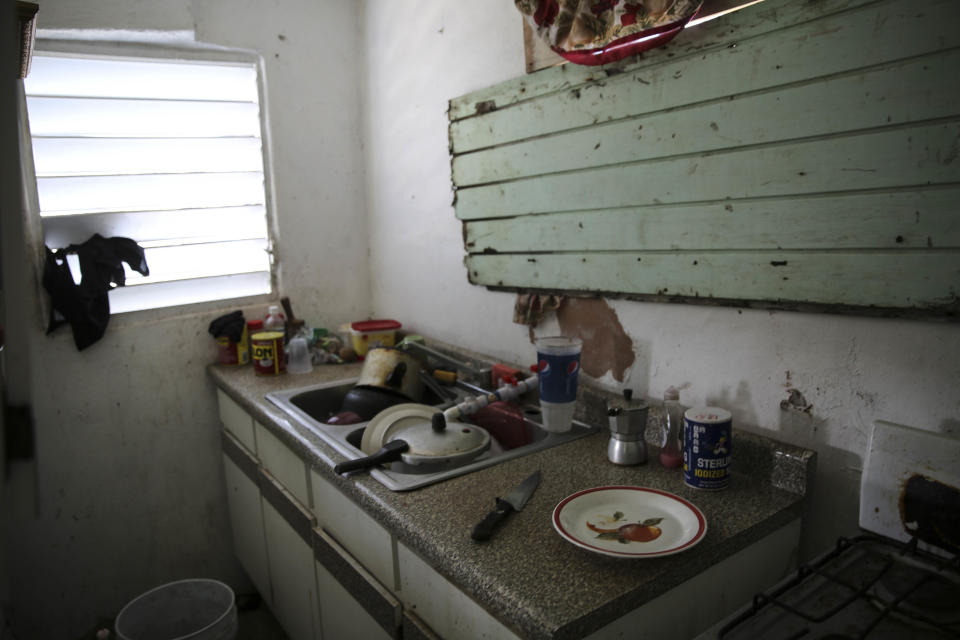 Felipe Pimental Severino blocked a broken window with a piece. Villa Hugo 2, Can&oacute;vanas, Puerto Rico. October 14, 2017.