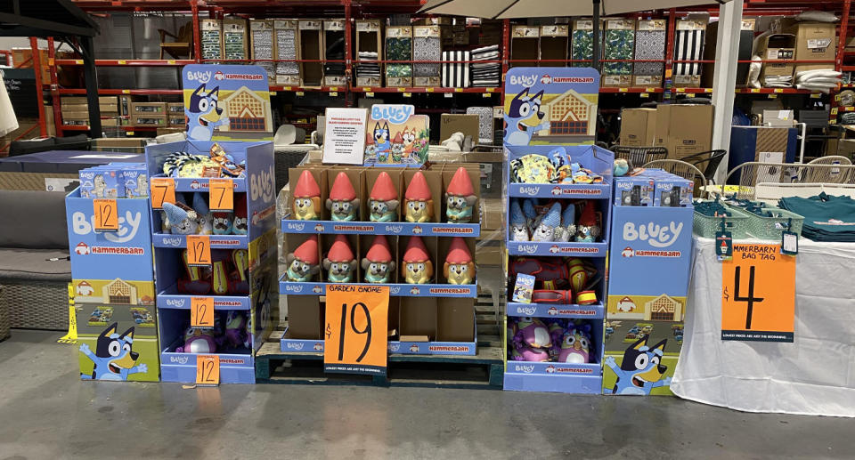 Bluey garden gnomes and other merchandise inside Bunnings store.