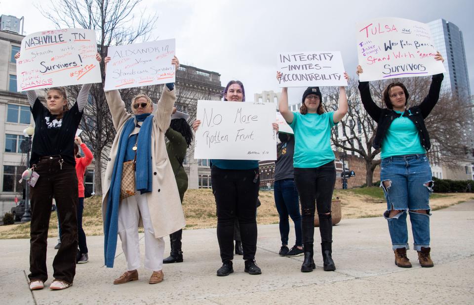 Many supporters of Hannah-Kate Williams, stands in front of the Southern Baptist Convention building in Nashville, Monday, Feb. 21, 2022, supporting survivors of sexual absue.