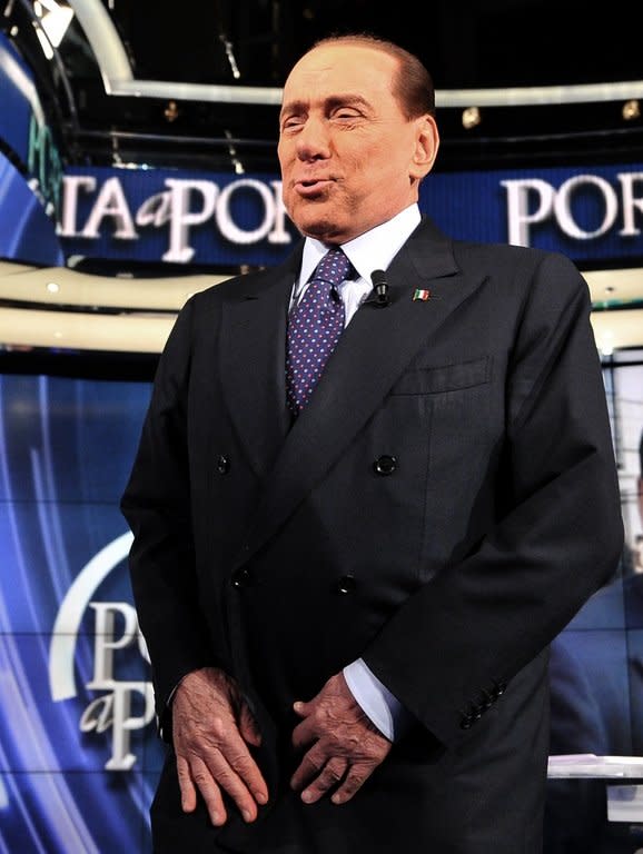Former Italian Prime Minister Silvio Berlusconi, pictured as he speaks on the set of RAI 1 television program'Porta a Porta', on January 9, 2013, in Rome. The exotic dancer at the centre of a sex trial against Berlusconi is expected to testify for the first time in court on Monday as the media tycoon bids for a fourth term as prime minister