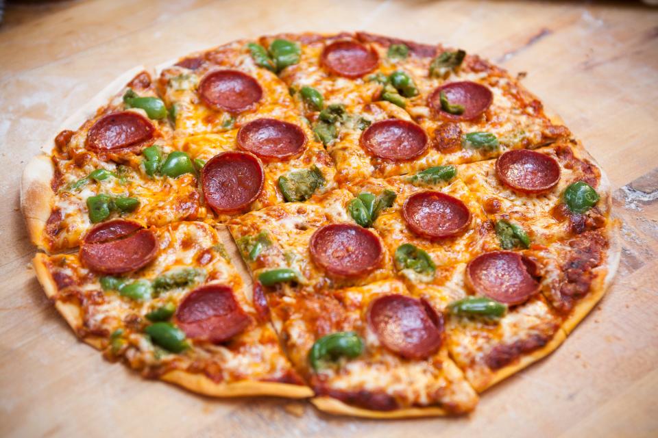 tavern style pizza round cut in squares thin crust