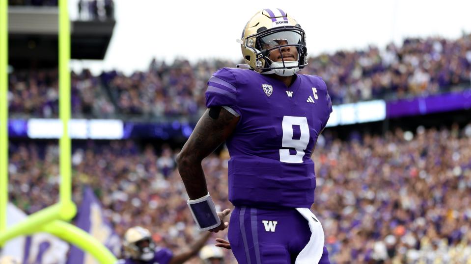 SEATTLE, WASHINGTON - OCTOBER 14: Michael Penix Jr. #9 of the Washington Huskies celebrates a touchdown against the Oregon Ducks during the first quarter at Husky Stadium on October 14, 2023 in Seattle, Washington. (Photo by Steph Chambers/Getty Images)