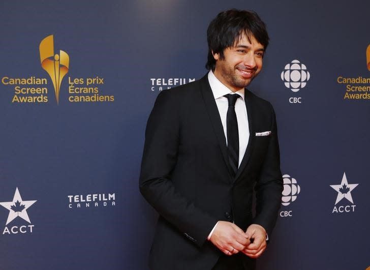 CBC personality Jian Ghomeshi arrives on the red carpet at the 2014 Canadian Screen awards in Toronto, March 9, 2014. REUTERS/Mark Blinch