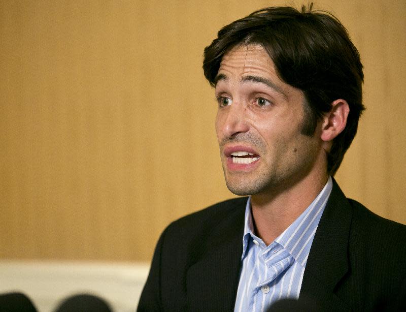 Plaintiff Michael Egan takes questions from to the media during a news conference in Beverly Hills, Calif., Thursday, April 17, 2014. A sex abuse lawsuit by Egan, a former child model and aspiring actor is accusing "X-Men" franchise director Bryan Singer of sexually abusing him as a teenager in a federal lawsuit filed in Hawaii. Singer's attorney, Marty Singer, said in a statement that the claims are absurd and defamatory. (AP Photo/Damian Dovarganes)