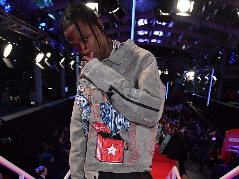 Travis Scott posed for photos at the EMAs but reportedly swerved fans questions. Source: Getty