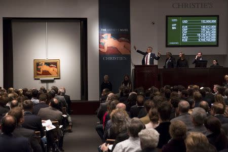 Christie's auctioneer Jussi Pylkkanen auctions Amedeo Modigliani's "Nu couche'" during a curated auction at Christie's entitled "The Artist's Muse" in Manhattan, New York November 9, 2015. REUTERS/Andrew Kelly