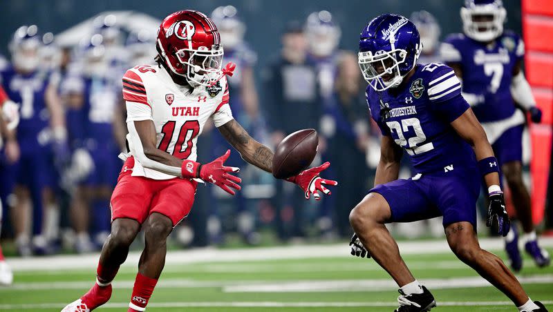 Utah Utes wide receiver Money Parks (10) reaches out to take the punt as Northwestern Wildcats defensive back Evan Smith (22) defends as Utah and Northwestern play in the SRS Distribution Las Vegas Bowl on Saturday, Dec. 23, 2023.