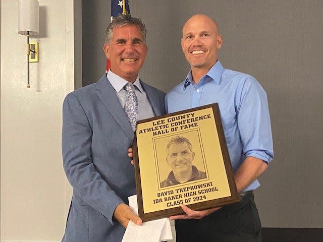 Former Ida Baker girls soccer coach Dave Trepkowski was among eight members of the Lee County Athletic Conference Hall of Fame's Class of 2024. With him is Ida Baker athletic director Dan Butler.