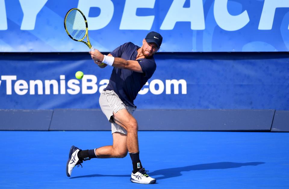 Christian Harrison of USA returns a backhand against Gianluca Mager (Getty Images)