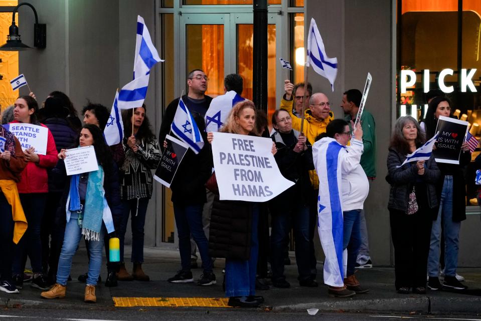 A demonstrator holds a sign reading "Free Palestine from Hamas" during a rally in support of Israel Monday, Oct. 9, 2023, in Bellevue, Washington.