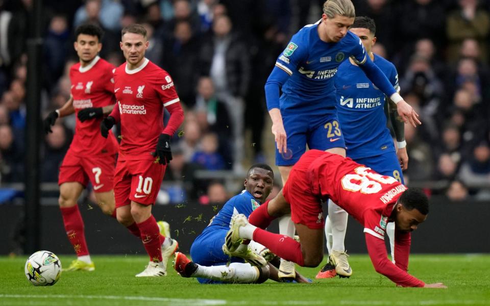 Moises Caicedo, left, tackles Liverpool's Ryan Gravenberch