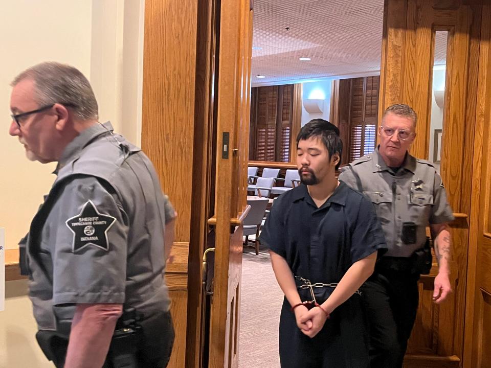 Ji "Jimmy" Sha, murder suspect and former international student at Purdue University, is escorted out of his Thursday hearing to determine if Sha's competency needs to be evaluated, on Thursday,  Dec. 15, 2022, in Lafayette, Ind.