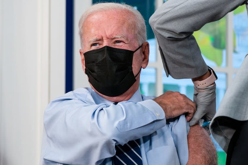 WASHINGTON, DC - SEPTEMBER 27: President Joe Biden receives a booster vaccination shot for CoVID19 in the South Court Auditorium of the Eisenhower Executive Office Building on the White House Complex on Monday, Sept. 27, 2021 in Washington, DC. (Kent Nishimura / Los Angeles Times)