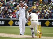 England's Stuart Broad (L) reacts after bowling to Australia's Shane Watson during the first day's play of the second Ashes test cricket match in Adelaide December 5, 2013.