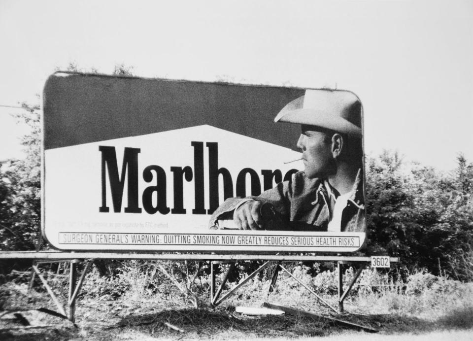 Seeing billboards advertising tobacco.