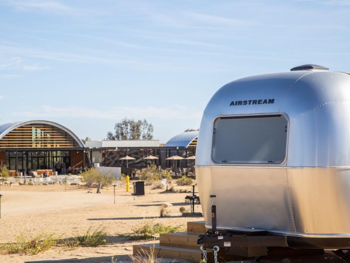 An Airsteram trailer near the main building at Autocamp's Joshua Tree location.