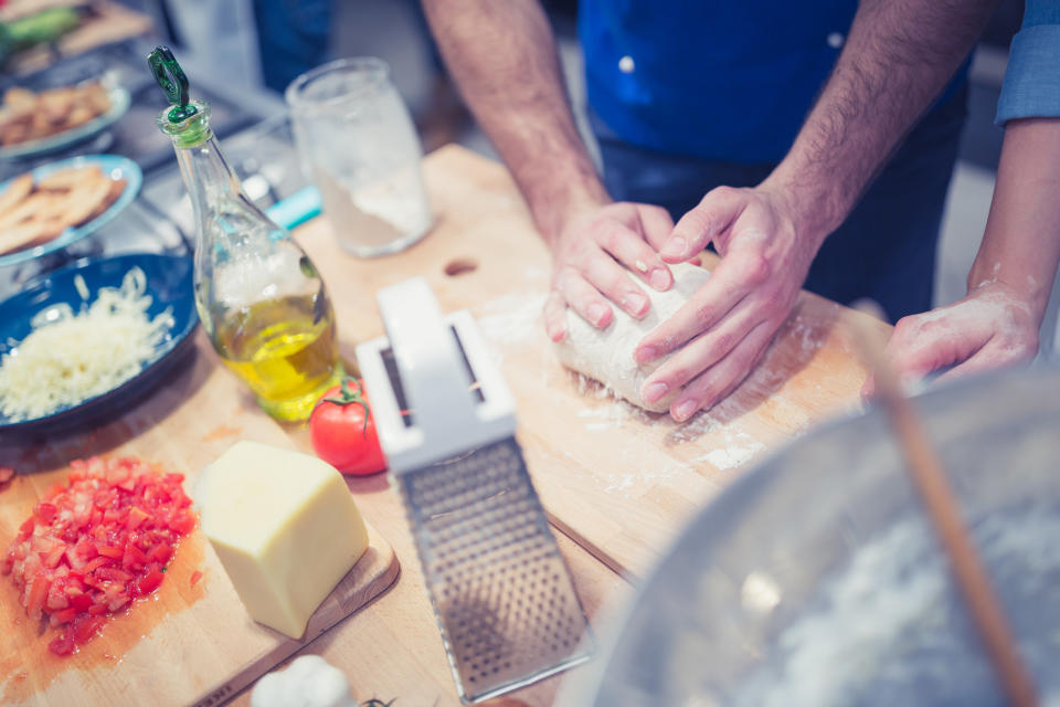 A man making pizza.