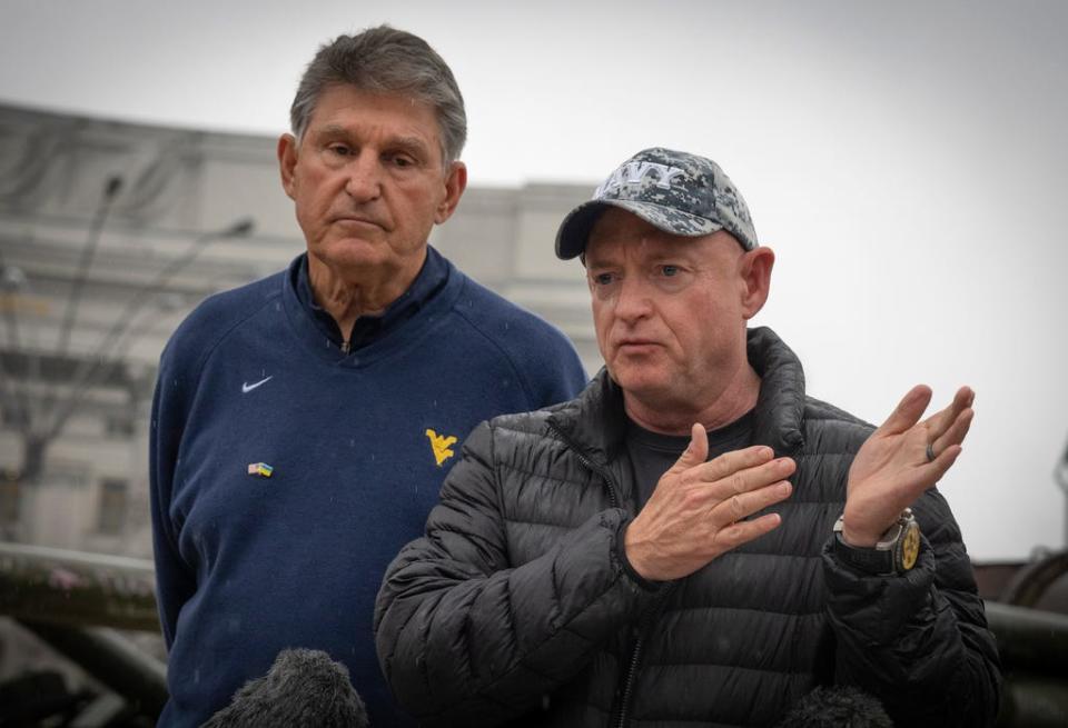 US Sens. Mark Kelly (right, D-Ariz.) and Joe Manchin, D-W.Va,answer media questions in Kyiv, Ukraine on April 12, 2023.