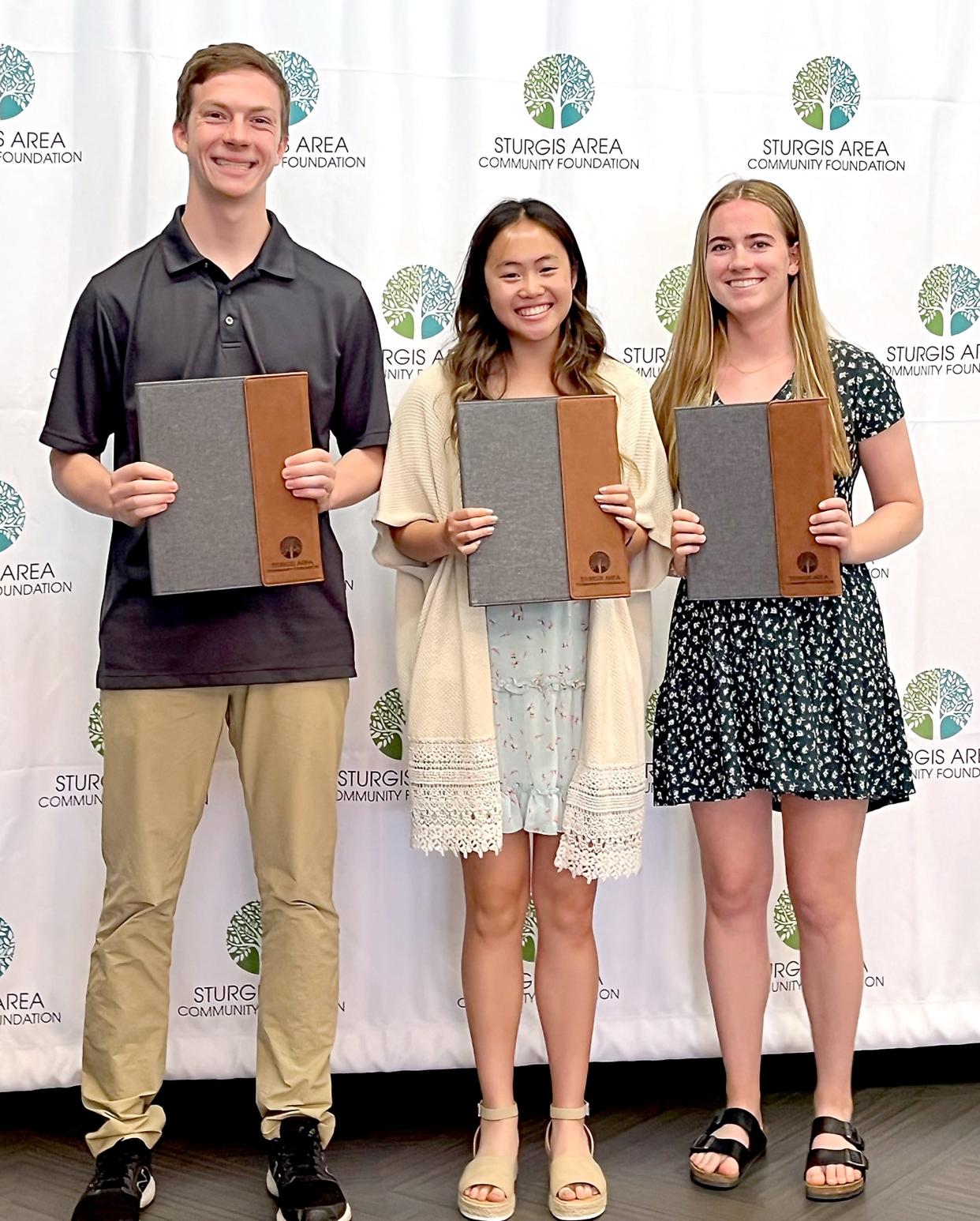 Sturgis High School seniors Matthew Toner, Tina Tran and Katie Strawser receive 2022 Robert and Barbara Hackman Memorial Scholarships.