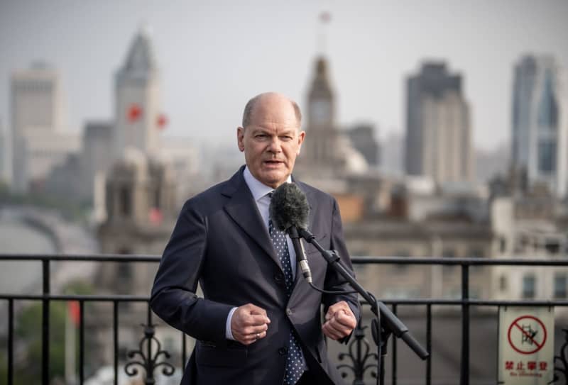 Germany's Chancellor Olaf Scholz speaks during a press statement in Shanghai. Scholz is scheduled to meet China's President Xi Jinping in Beijing at the end of his trip. Michael Kappeler/dpa