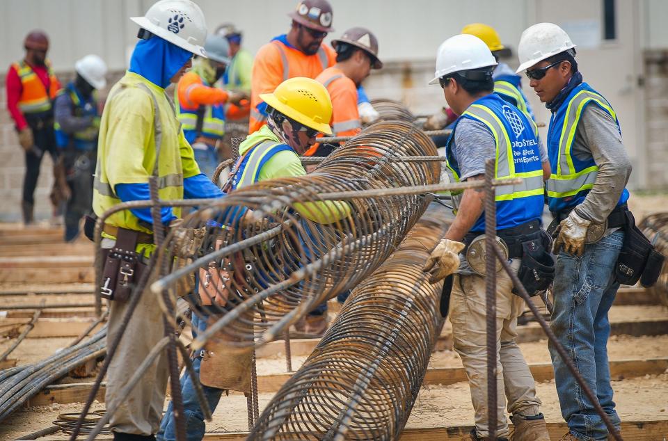 Construction workers work on steel rebar on March 2 during the expansion process for Pflugerville's water treatment plant.