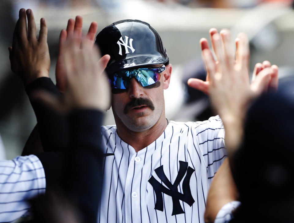 New York Yankees designated hitter Matt Carpenter (24) celebrates in the dugout after scoring against the Kansas City Royals during the fifth inning of a baseball game, Sunday, July 31, 2022, in New York. (AP Photo/Noah K. Murray)
