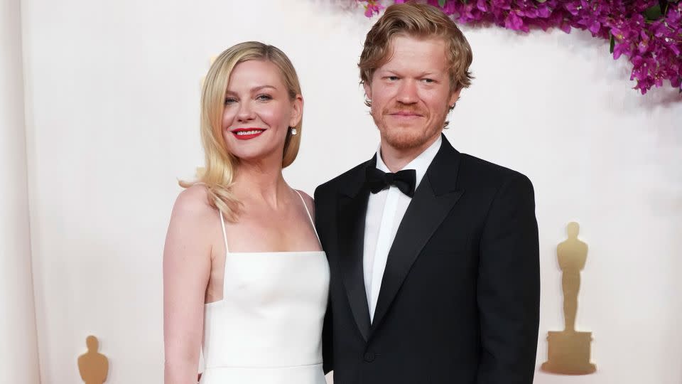 Kirsten Dunst, who arrived alongside husband Jesse Plemons, wore a classy Gucci dress with a sharp-edged neckline and a sleek floor-length silhouette. The actor completed the look with Fred Leighton jewelry. - Jordan Strauss/Invision/AP