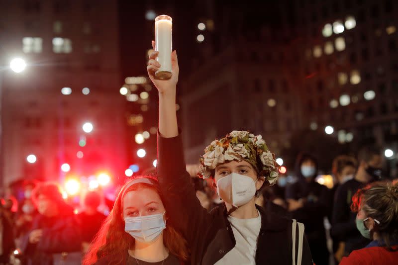 People gather for a vigil outside of the New York State Civil Supreme Court building held for recently passed Associate Justice of the Supreme Court of the United States Ruth Bader Ginsburg in Manhattan, New York City