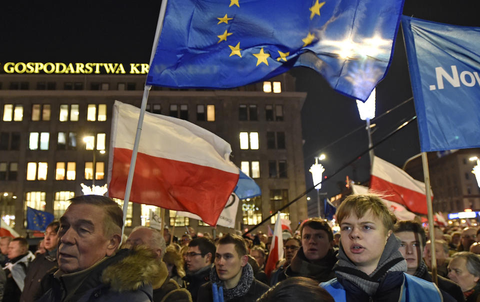 Anti-government protesters march through the downtown on the anniversary of imposition of the 1981martial law by the country's former communist regime, in Warsaw, Poland, Tuesday, Dec. 13, 2016. (AP Photo/Alik Keplicz)