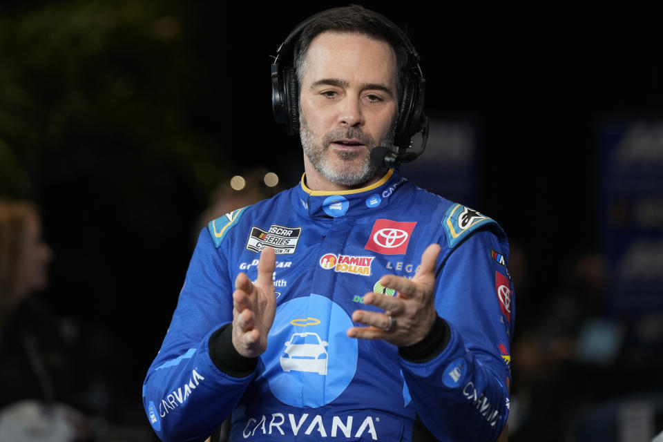 Jimmie Johnson takes part in an interview during NASCAR Daytona 500 auto racing media day at Daytona International Speedway, Wednesday, Feb. 14, 2024, in Daytona Beach, Fla. (AP Photo/John Raoux)